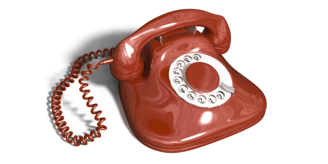 Ein rotes Telefon mit Wählscheibe
